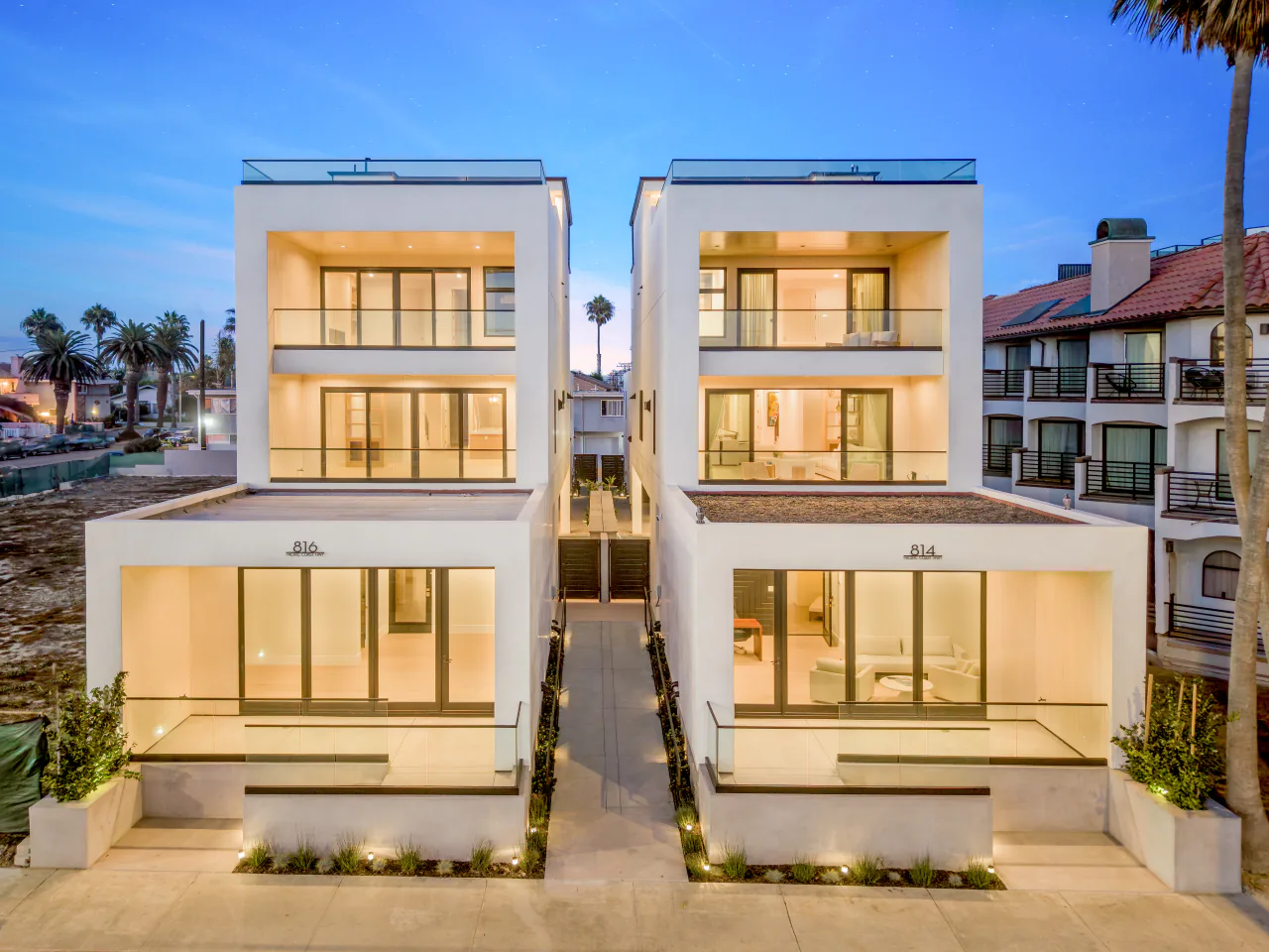 The neighboring 814 and 816 PCH homes at dusk