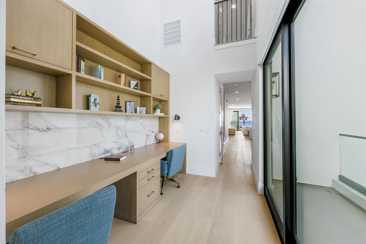 Bar counter with shelving and blue stools