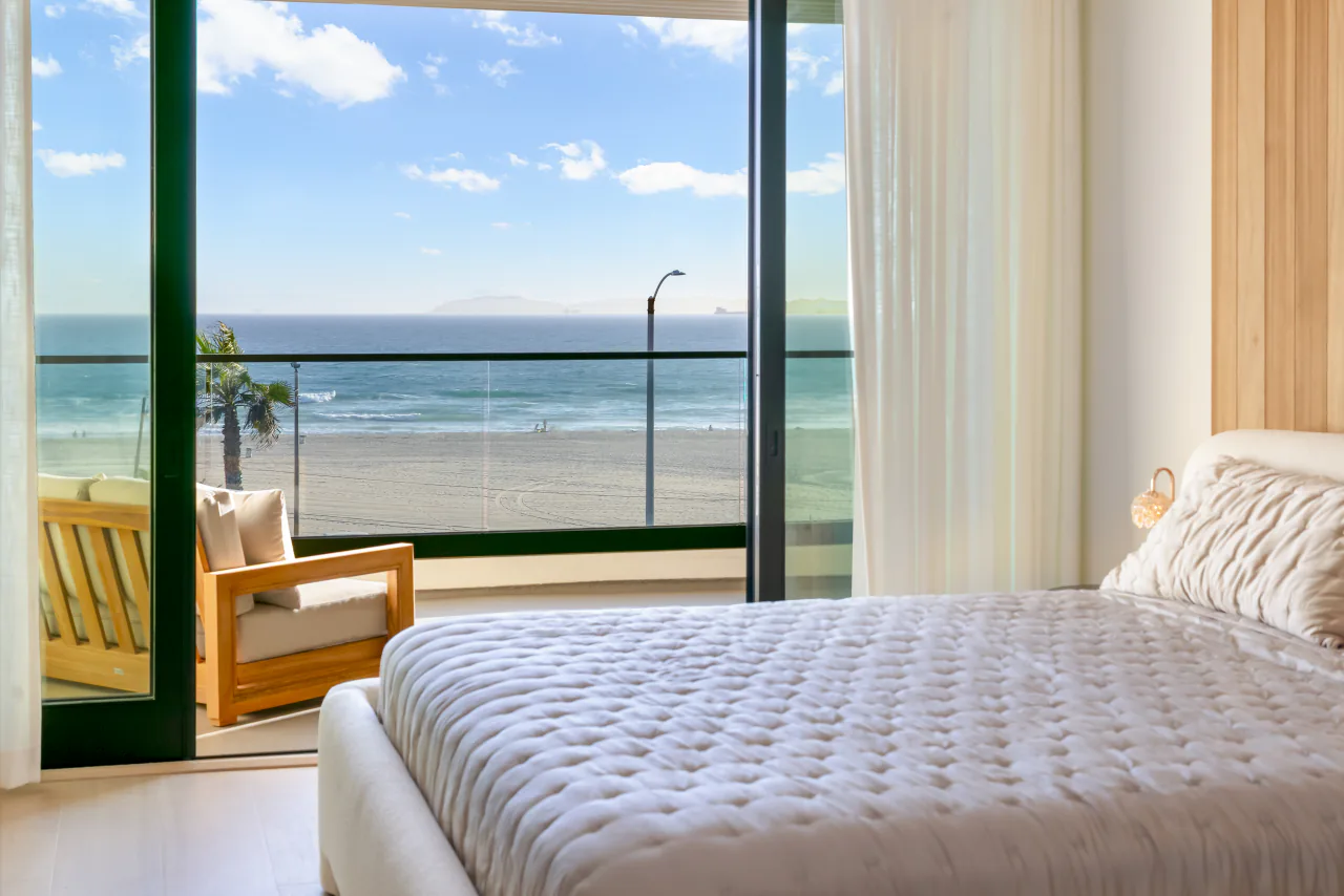 Bedroom looking toward a balcony and the Pacific
